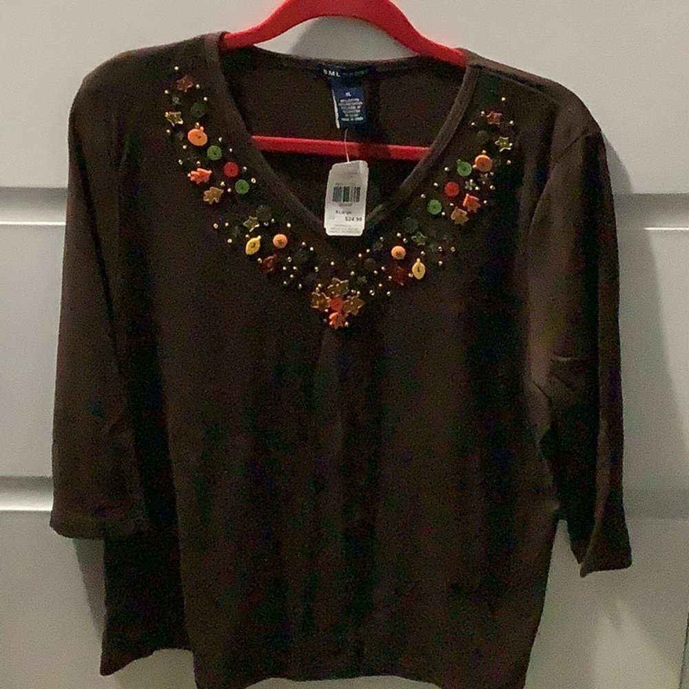 New woman’s button and sequin decorated 3/4 sleeve brown top
